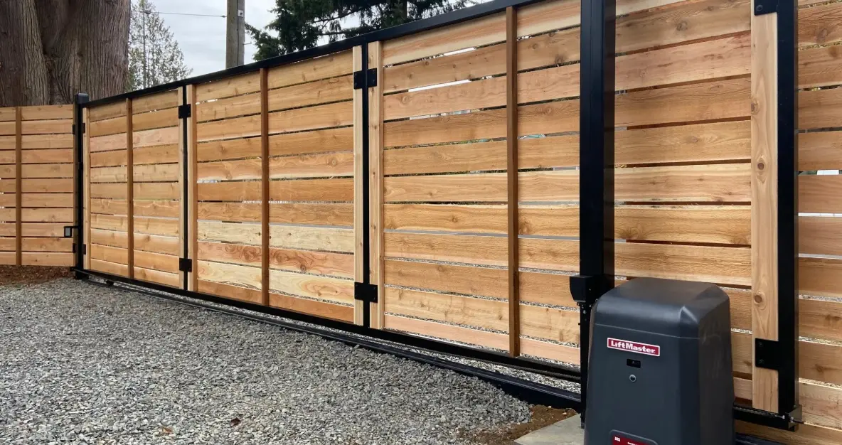 Automated wooden security gate with operator installed at a commercial property