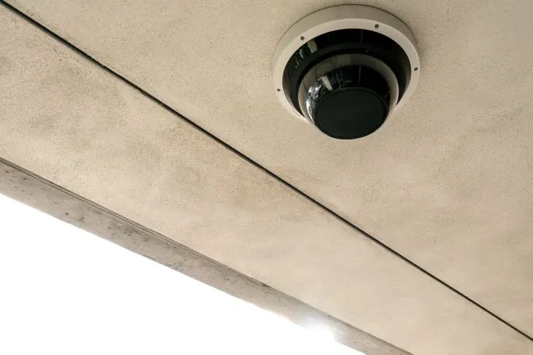 AK Technologies technician installing security devices on a commercial site in Austin