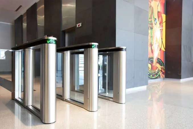 Optical turnstiles and speed lanes installed in a commercial building lobby